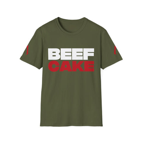 The image shows a military green softstyle t-shirt with a bold design. The text “BEEF CAKE” is printed in large capital letters, with “BEEF” in white and “CAKE” in red. The shirt also features red vertical stripes on both sleeves. This t-shirt is ideal as one of the best gym tees, suitable for women’s exercise shirts, and serves as a gym full shirt.