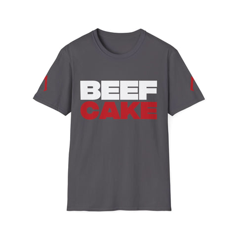 The image shows a charcoal grey softstyle t-shirt with a bold design. The text “BEEF CAKE” is printed in large capital letters, with “BEEF” in white and “CAKE” in red. The shirt also features red vertical stripes on both sleeves. This t-shirt is an example of cool gym wear and is part of the best women’s exercise clothes collection. It is perfect for those looking for cool workout clothes for women.